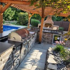 outdoor grill area by pool