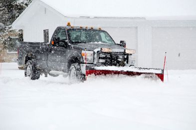 Photo of truck plowing snow